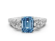 Fancy Blue Emerald Cut Diamond Three-Stone Ring Set in Platinum with Round Side Stones and Pavé Band