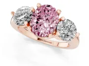 Fancy Pink Oval Cut Diamond Three-Stone Ring Set in Rose gold with Prong Setting and Classic Band