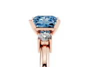 Fancy Blue Three-Stone Princess Cut Diamond Ring Set in Rose gold with Prong Setting and Plain Band