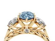 Fancy Blue Marquise Cut Diamond Three-Stone Ring Set in Yellow gold with Braided Band