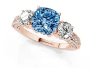 Fancy Blue Cushion Cut Diamond Three-Stone Ring Set in Rose gold with Round Side Stones and Pavé Band