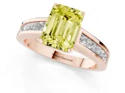 Fancy Yellow Emerald Cut Diamond Solitaire Ring Set in Rose gold with Channel-Set Band and Prong Setting
