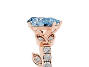 Fancy Blue Pear Cut Diamond Solitaire Leaf-Inspired Ring Set in Rose gold with Pavé Band and Prong Setting