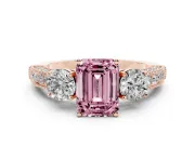 Fancy Pink Emerald Cut Diamond Three-Stone Ring Set in Rose gold with Round Side Stones and Pavé Band