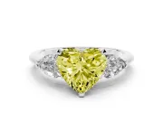 Fancy Yellow Three-Stone Heart Cut Diamond Ring Set in Platinum with Pear Side Stones and Prong Setting