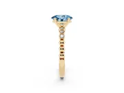 Fancy Blue Oval Cut Diamond Solitaire Engagement Ring Set in Yellow gold with Bezel Accents on Beaded Band