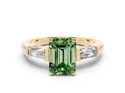 Fancy Green Emerald Cut Diamond Solitaire Ring Set in Yellow gold with Tapered Baguette Side Stones and Prong Setting