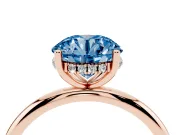 Fancy Blue Round Cut Diamond Solitaire Engagement Ring Set in Rose gold with Prong Setting and Polished Band