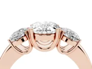 Oval Cut Diamond Three-Stone Ring Set in Rose gold with Polished Band and Prong Setting