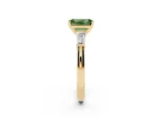Fancy Green Emerald Cut Diamond Solitaire Ring Set in Yellow gold with Tapered Baguette Side Stones and Prong Setting