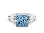 Fancy Blue Three-Stone Princess Cut Diamond Ring Set in Silver with Prong Setting and Plain Band
