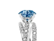 Fancy Blue Round Cut Diamond Solitaire Twist Band Ring Set in Platinum with Pavé Setting and Prong Head