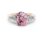 Fancy Pink Three-Stone Oval Cut Diamond Ring Set in Rose gold with Pear Side Stones and Prong Setting