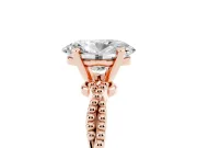 Oval Cut Diamond Solitaire Ring Set in Rose gold with Twisted Band and Bead Prong Setting