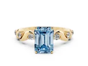 Fancy Blue Emerald Cut Diamond Solitaire Ring Set in Yellow gold with Ribbon Twist Band, Round Accents and Prong Setting