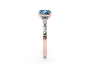 Fancy Blue Princess Cut Diamond Solitaire Set in Rose gold with Side Baguettes and Channel Set Band