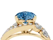 Fancy Blue Heart Cut Diamond Halo Ring Set in Yellow gold with Marquise and Pavé Band in Prong Setting
