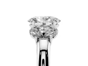 Oval Cut Diamond Three-Stone Ring Set in Platinum with Bold Center and Classic Band