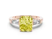 Fancy Yellow Radiant Cut Diamond Solitaire Ring Set in Rose gold with Tapered Baguette Side Stones and Prong Setting