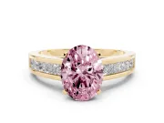 Fancy Pink Oval Cut Diamond Solitaire Ring Set in Yellow gold with Channel-Set Band and Prong Setting
