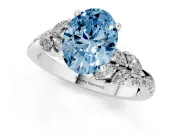 Fancy Blue Oval Cut Diamond Solitaire Ring Set in Platinum with Marquise Twist Band and Prong Setting