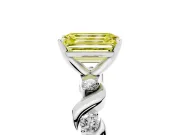 Fancy Yellow Emerald Cut Diamond Solitaire Ring Set in White gold with Ribbon Twist Band, Round Accents and Prong Setting
