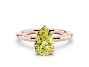 Fancy Yellow Pear Cut Diamond Solitaire Ring Set in Rose gold with Thin Band and Prong Setting