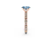 Fancy Blue Oval Cut Diamond Solitaire Ring Set in Rose gold with Slim Pavé Band and Prong Setting