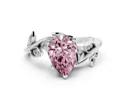 Fancy Pink Pear Cut Diamond Solitaire Twist Engagement Ring Set in Platinum with Pavé Leaf Accents