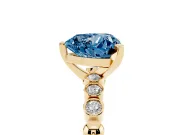Fancy Blue Heart Cut Diamond Solitaire Engagement Ring Set in Yellow gold with Bezel Accents on Beaded Band