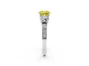 Fancy Yellow Cushion Cut Diamond Three-Stone Ring Set in Platinum with Round Side Stones and Pavé Band
