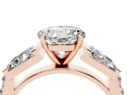 Round Cut Diamond Engagement Ring Set in Rose gold with Baguette Side Stones and Channel Set Band