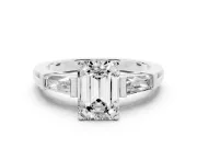 Emerald Cut Diamond Solitaire Ring Set in Platinum with Tapered Baguette Side Stones and Prong Setting