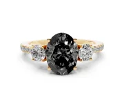 Fancy Black Oval Cut Diamond Three-Stone Ring Set in Yellow gold with Pavé Band and Graduated Sides