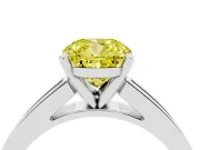 Fancy Yellow Cushion Cut Diamond Solitaire Ring Set in White gold with Channel-Set Band and Prong Setting