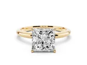 Princess Cut Diamond Solitaire Engagement Ring Set in Yellow gold with Prong Setting and Polished Band