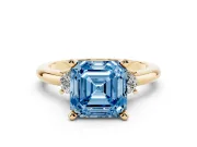 Fancy Blue Three-Stone Asscher Cut Diamond Ring Set in Yellow gold with Prong Setting and Plain Band
