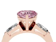 Fancy Pink Heart Cut Diamond Solitaire Ring Set in Rose gold with Tapered Baguette Side Stones and Prong Setting