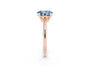 Fancy Blue Oval Cut Diamond Solitaire Ring Set in Rose gold with Prong Setting on a Plain Round Band