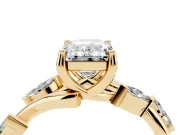 Emerald Cut Diamond Solitaire Ring Set in Yellow gold with Twisted Marquise Accent Band