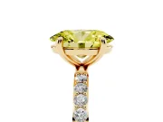 Fancy Yellow Oval Cut Diamond Solitaire Ring Set in Yellow gold with Round Pavé Band and Prong Setting