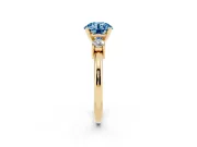 Fancy Blue Three-Stone Round Cut Diamond Ring Set in Yellow gold with Prong Setting and Plain Band