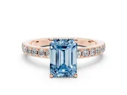 Fancy Blue Emerald Cut Diamond Solitaire Set in Rose gold with Round Pavé Band and Prong Setting