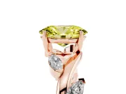 Fancy Yellow Oval Cut Diamond Solitaire Ring Set in Rose gold with Twisted Marquise Accent Band