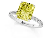 Fancy Yellow Radiant Cut Diamond Solitaire Ring Set in White gold with Round Pavé Band and Prong Setting