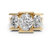 Oval Cut Diamond Three-Stone Channel Set Ring Set in Yellow gold with Smooth Polished Band