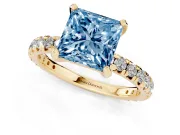 Fancy Blue Princess Cut Diamond Pavé Solitaire Ring Set in Yellow gold with Round Band and Prong Setting