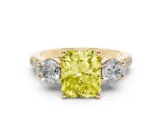 Fancy Yellow Three-Stone Radiant Cut Diamond Pavé Band Ring Set in Yellow gold with Prong-Set Trio