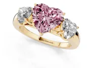 Fancy Pink Heart Cut Diamond Three-Stone Ring Set in Yellow gold with Bold Center and Classic Band