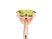 Fancy Yellow Oval Cut Diamond Solitaire Ring Set in Rose gold with Prong Setting on a Plain Round Band